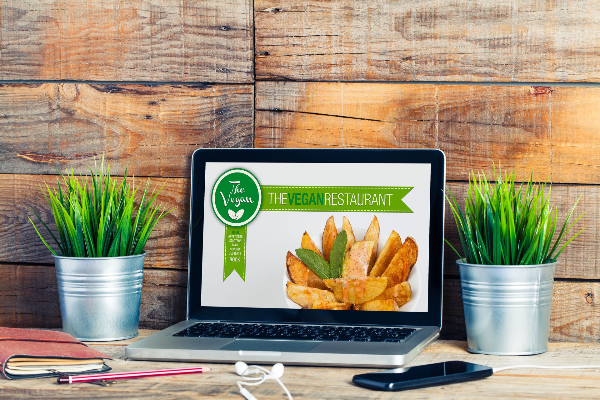 Vegan restaurant website in a laptop computer.